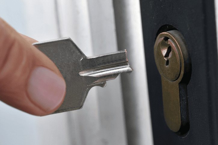 An image showing a broken key stuck inside a lock, demonstrating how to get a broken key out of a lock.